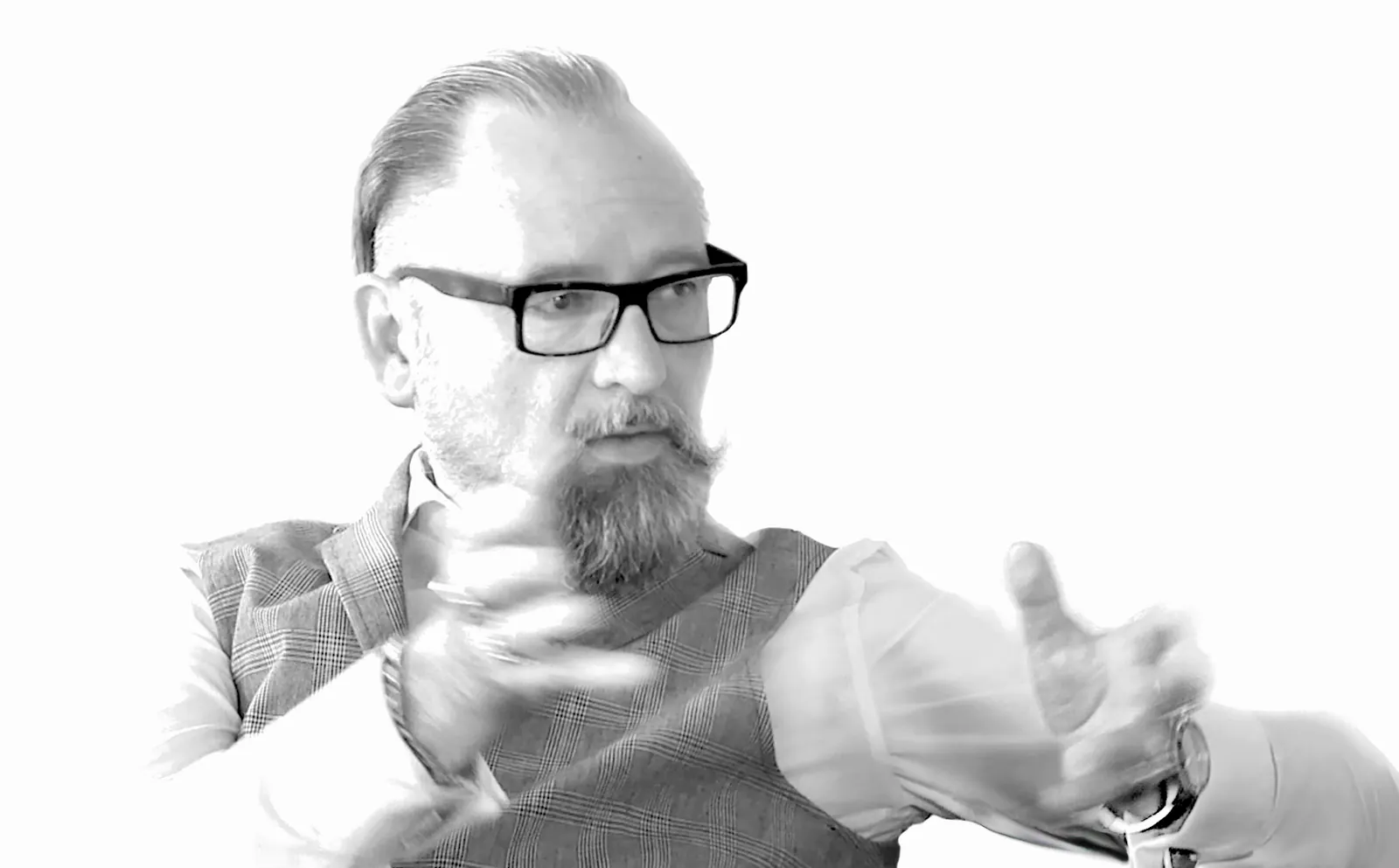 Olaf Neumann in conversation, black-and-white portrait